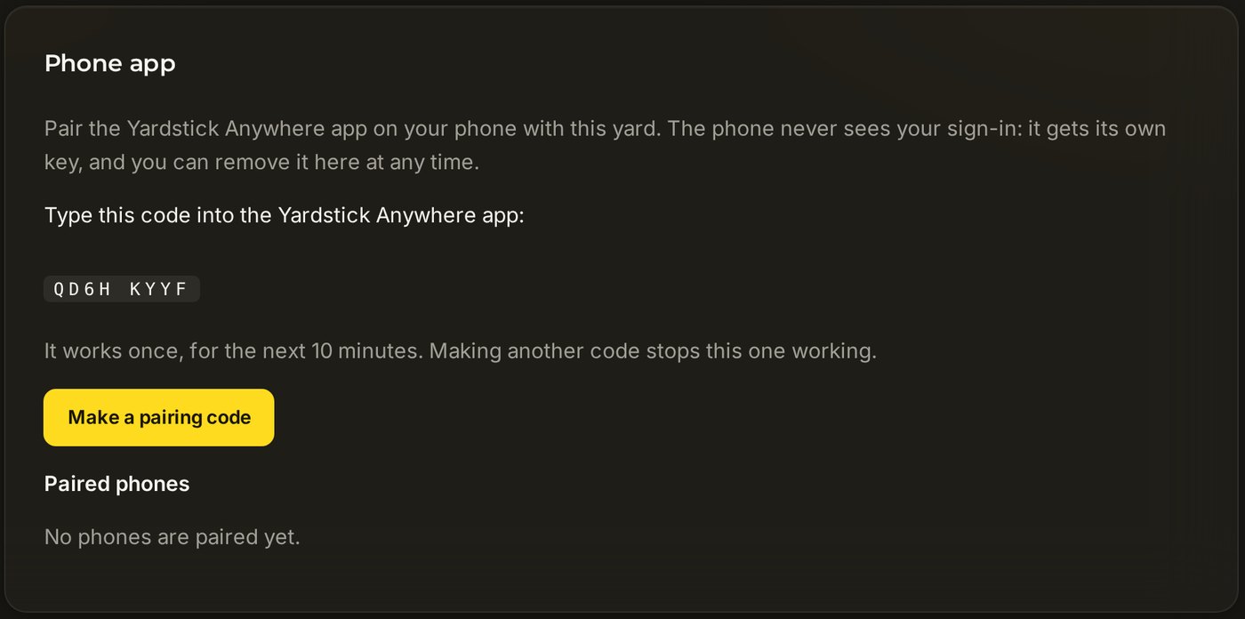 The Phone app card in Settings, showing a pairing code to type into the app, the Make a pairing code button, and the list of paired phones.