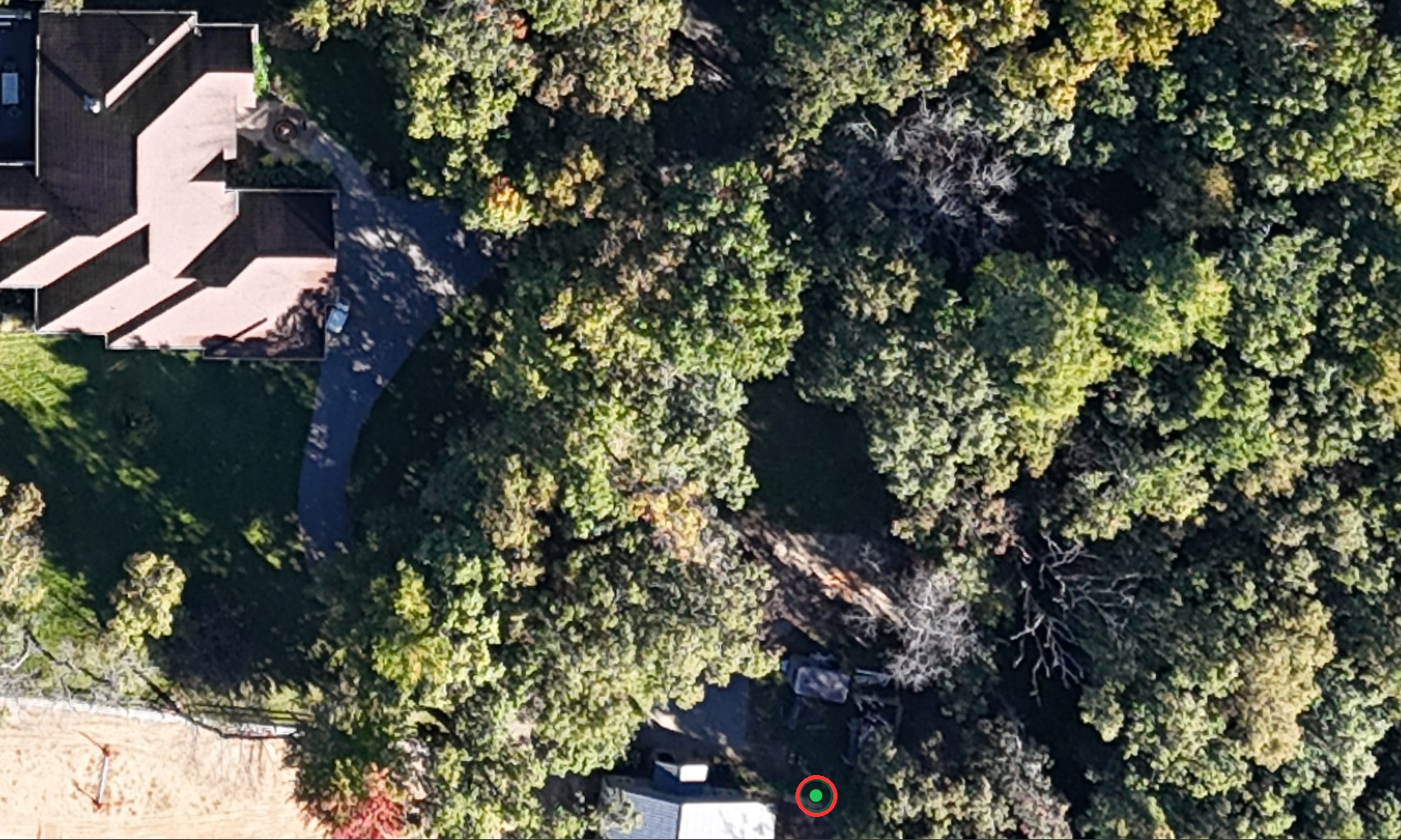 Zoomed in close on the drone photo, with every layer off except the photo and the green dot of the robot sitting at its dock.